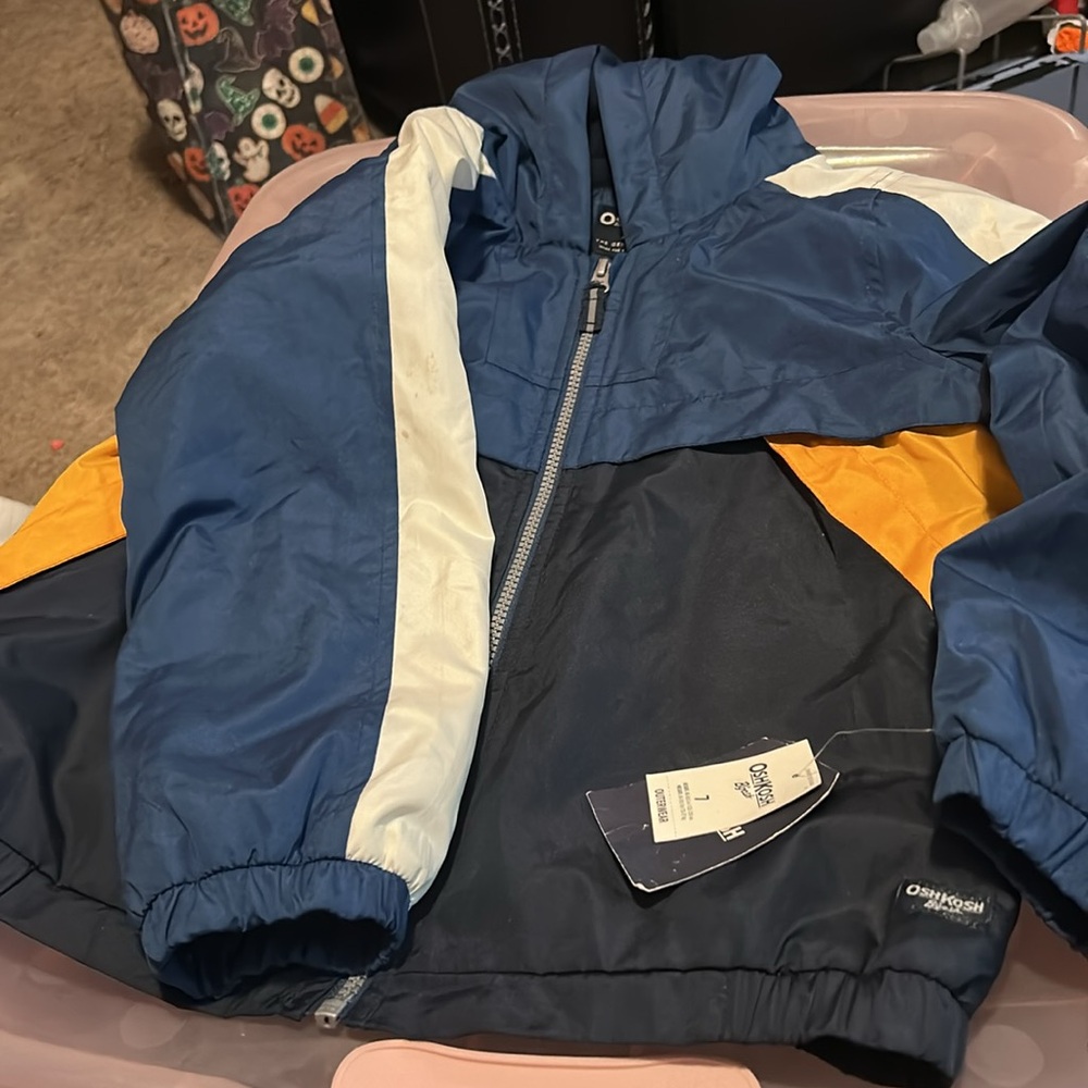 Oshkosh B’gosh Boys size 7 Windbreaker 
Tricolor blue. 
New with Tags (NWT)!